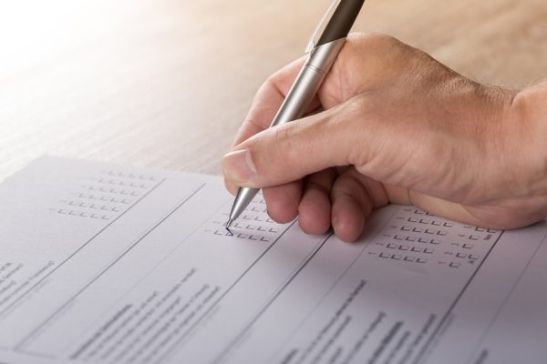 Filling Out Paper Survey | How to Create A Resident Feedback Process